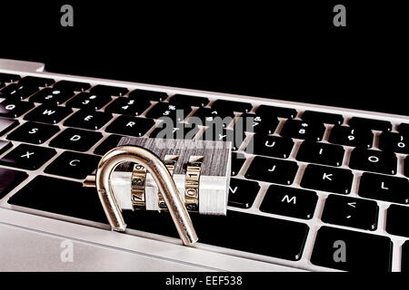 Laptop computer with broken combination lock Stock Photo