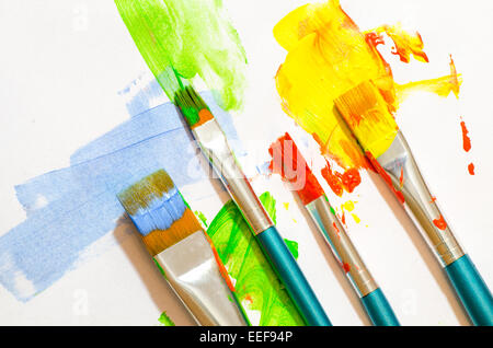 brush strokes and paint brushes on white paper background Stock Photo