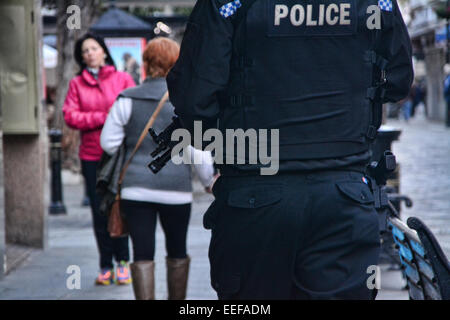 Gibraltar. 17th Jan, 2015. Armed patrols and police dog units have been deployed to patrol Gibraltar's city centre in an unprecedented increase in Gibraltar. Armed police officers were seen in Main Street supporting unarmed Police patrols who were today seen patrolling in pairs at all times. Credit:  Stephen Ignacio/Alamy Live News Stock Photo