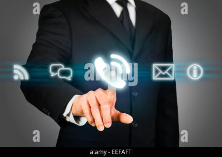 Businessman clicking on call icon Stock Photo