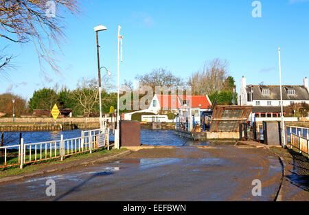 A view of a vehicle aboard Reedham Ferry and crossing the River Yare on the Norfolk Broads, England, United Kingdom. Stock Photo