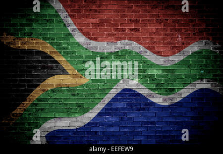 South African flag over a grunge brick background. Stock Photo