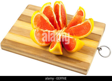 Red grapefruit slices on a wooden board Stock Photo