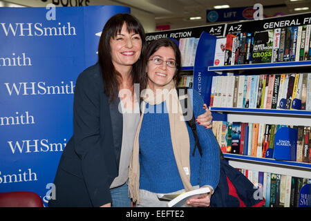 Davina McCall one of Britain's best loved TV Presenters poses with a fan during her book signing at WHSmith in Bromley Stock Photo