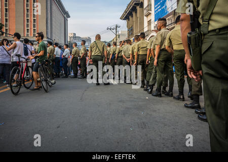 Intramuros, Manila, Philippines, 16th Jan 2015. A group of Philippine Army gets ready in one of the streets surrounding Manila Cathedral on Friday, January 16, 2015 to ensure the security of thousands of people expected to gather around the cathedral to get a glimpse of Pope Francis during the Holy Father's visit to the Philippines. Credit:  tonyoquias/Alamy Live News Stock Photo