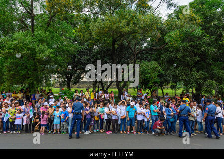 Intramuros, Manila, Philippines, 16th Jan 2015. Filipinos from all walks of life gather and wait for the motorcade of Pope Francis on Friday, January 16, 2015 to get a glimpse of the Holy Father during his Apostolic Visit to the Philippines. Credit:  tonyoquias/Alamy Live News Stock Photo