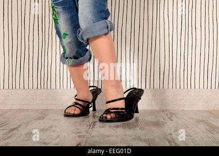 girl shoes with heels of her mom Stock Photo