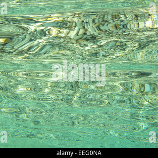 Underwater image of rocks and reflections in calm sea water, abstract patterns evoke feelings of calm serenity tranquility Stock Photo