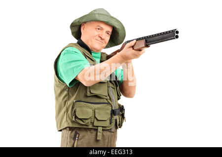 Mature hunter aiming with a shotgun isolated on white background Stock Photo