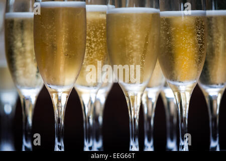 Glasses of champagne served on tray Stock Photo
