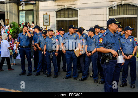 Intramuros, Manila, Philippines, 16th Jan 2015. A group of Philippine National Police gets ready in one of the streets surrounding Manila Cathedral on Friday, January 16, 2015 to ensure the security of thousands of people expected to gather around the cathedral to get a glimpse of Pope Francis. Stock Photo