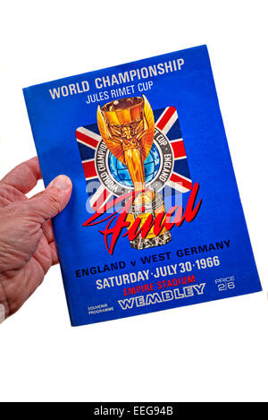 Hand holding a World Cup Final 1966 England v West Germany program (programme) Stock Photo