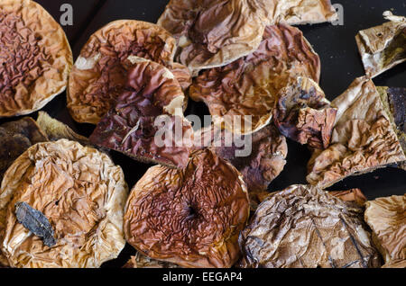 dried porcini mushrooms on wooden background Stock Photo