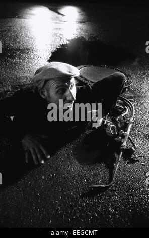 Hamburg, Germany, burglar creeping out Gully Stock Photo