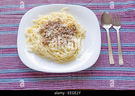Italian spaghetti topped with bolognaise, or bolognese, sauce with tomatoes, meat and cheese Stock Photo