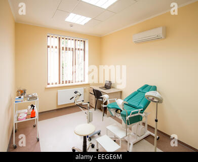 Gynecological cabinet with chair and medical equipment with nobody Stock Photo