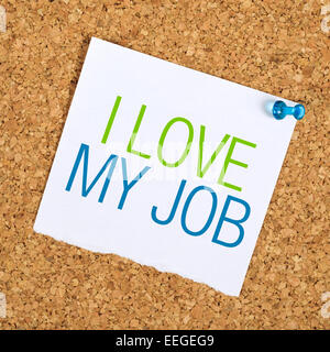 I Love My Job Reminder Note Pinned to a Cork Memory Bulletin Board on Office Wall Stock Photo