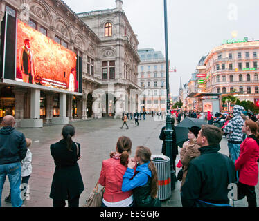 People watching open air live Opera outside the State Opera House in  Karajan Platz Vienna in Austria Stock Photo - Alamy