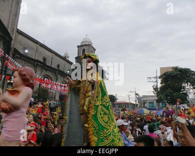 Tondo, Philippines. 18th Jan, 2015. Before going to Pope Francis' Holy Mass at Quirino Grandstand, thousands of Catholic devotees flocked to Tondo Church bringing with them their images of Sto. Nino or Infant Jesus for the annual Feast of the Infant Jesus in Tondo Manila. The feast coincides with the last holy mass of Pope Francis in Manila. Credit:  Sherbien Dacalanio/Alamy Live News Stock Photo