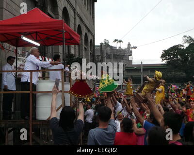 Tondo, Philippines. 18th Jan, 2015. Before going to Pope Francis' Holy Mass at Quirino Grandstand, thousands of Catholic devotees flocked to Tondo Church bringing with them their images of Sto. Nino or Infant Jesus for the annual Feast of the Infant Jesus in Tondo Manila. The feast coincides with the last holy mass of Pope Francis in Manila. Credit:  Sherbien Dacalanio/Alamy Live News Stock Photo