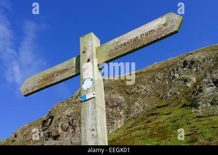 A wooden signpost on the Berwickshire coastal footpath at St Abbs, Scotland. Stock Photo