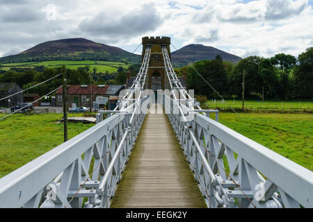 The iron suspension chainbridge across the River Tweed at Melrose, Scottish Borders. The Eildon Hills in the background. Stock Photo