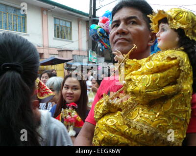 Tondo, Philippines. 18th Jan, 2015. Before going to Pope Francis' Holy Mass at Quirino Grandstand, thousands of Catholic devotees flocked to Tondo Church bringing with them their images of Sto. Nino or Infant Jesus for the annual Feast of the Infant Jesus in Tondo Manila. The feast coincides with the last holy mass of Pope Francis in Manila. Credit:  Sherbien Dacalanio/Alamy Live News Stock Photo