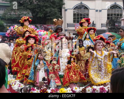 Tondo, Philippines. 18th Jan, 2015. Before going to Pope Francis' Holy Mass at Quirino Grandstand, thousands of Catholic devotees flocked to Tondo Church bringing with them their images of Sto. Nino or Infant Jesus for the annual Feast of the Infant Jesus in Tondo Manila. The feast coincides with the last holy mass of Pope Francis in Manila. Credit:  Sherbien Dacalanio/Alamy Live News Stock Photo