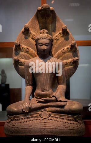 Image of Buddha sheltered with naga hoods (dated 1183 A.D.) at National Museum in Bangkok, Thailand. Stock Photo