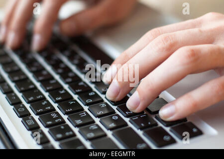 Female fingers on the keyboard close-up. Stock Photo