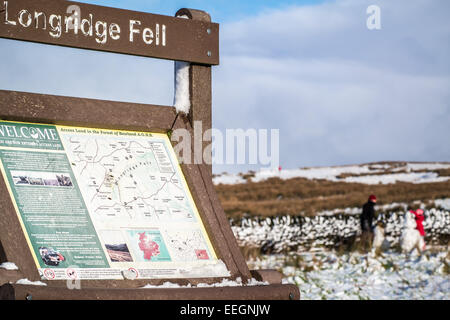 Longridge Fell, Forest of Bowland, Lancashire, UK. 18th Jan 2015. Weather news. A cold day out on the fells in the Forest of Bowland gives kids and families fun out playing in the snowscape. The snow in the forest and on the fell makes a picturesque scene Credit: Gary Telford/Alamy live news Stock Photo