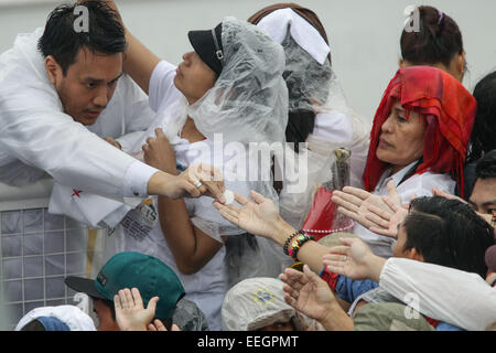 Manila, Philippines. 18th Jan, 2018. The crowd reachout their hands to get communion during Pope Francis' closing mass at the uirino Grandstand, Rizal Park on January 18, 2015. The mass was attended by an estimate of 6-7 million people. Photo by Mark Cristino. Credit:  Mark Fredesjed Cristino/Alamy Live News Stock Photo