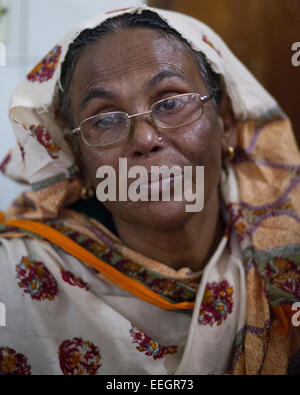 Mother of Sathi Akter 18 crying at burn unit of Dhaka Medical College Hospotal (DMCH) as picketers set fire to a bus in the eastern side of Sangshad Bhaban in Dhaka during BNP-led 20-party's countrywide blockade. Two students are injured with burns to their legs after blockaders hurled petrol bombs at the bus they were riding on the bus. Stock Photo