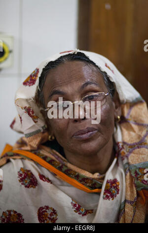 Mother of Sathi Akter 18 crying at burn unit of Dhaka Medical College Hospotal (DMCH) as picketers set fire to a bus in the eastern side of Sangshad Bhaban in Dhaka during BNP-led 20-party's countrywide blockade. Two students are injured with burns to their legs after blockaders hurled petrol bombs at the bus they were riding on the bus. Stock Photo