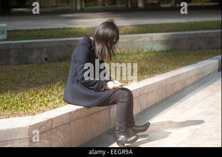 Hong Kong Business woman on her phone. Stock Photo
