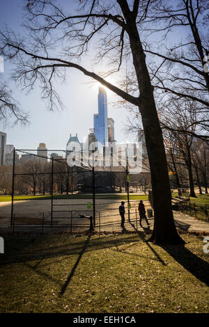 The  90 story luxury tower One57, center, on West 57th Street in Midtown Manhattan in New York is seen casting its shadow over Central Park on Saturday, January 17, 2015. A record has been set with the an undisclosed buyer purchasing a duplex in the luxury tower for the uber-rich for $100,471,452.77. The buyer purchased the 89th and 90th floors on the over 1000 foot tall residential building. (© Richard B. Levine) Stock Photo