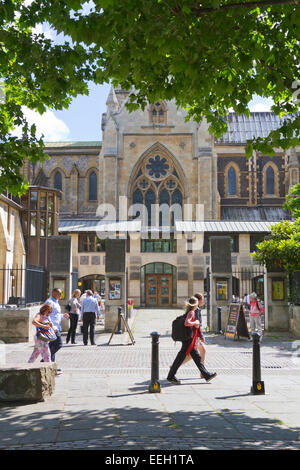 People walking past Southwark Cathedral in London England Stock Photo