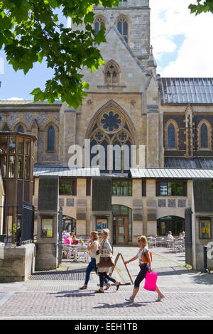 People walking past Southwark Cathedral in London England Stock Photo