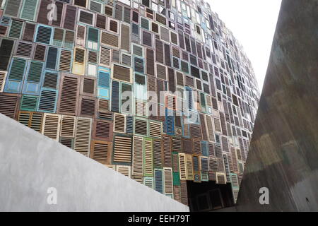 Exterior wall of a bar and restaurant clad in old wooden window shutters. Stock Photo