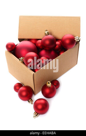 Christmas decorations: group of red Christmas balls in a kraft corrugated cardboard box, Christmas tree decorations, isolated on Stock Photo