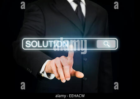 Businessman searching for solution Stock Photo