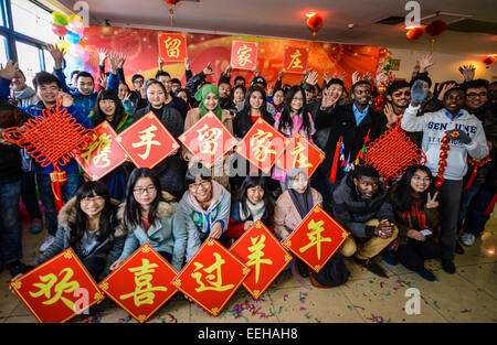 Hangzhou, China's Zhejiang Province. 19th Jan, 2015. Students pose for a group photo at the opening ceremony of the winter club at Zhejiang University of Technology in Hangzhou, capital of east China's Zhejiang Province, Jan. 19, 2015. A winter club was created on Monday to provide cultural activities for over 300 students who are to spend the winter vacation and celebrate the Spring Festival at the university. The Spring Festival, or the Chinese traditional lunar New Year, starts on Feb. 19 this year. © Xu Yu/Xinhua/Alamy Live News Stock Photo