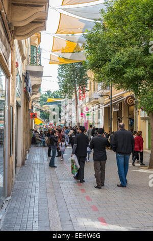 People shopping and tourists along Ledra Street in central Nicosia, Capital city of Cyprus - EDITORIAL USE ONLY Stock Photo