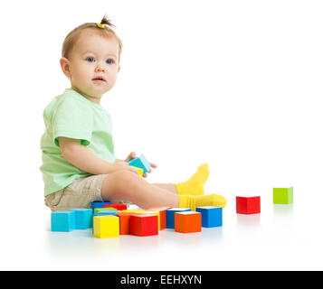 baby playing with colorful blocks isolated Stock Photo