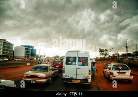 Street vendors take advantage of traffic jam to sell producs on the road, Accra, Ghana. Stock Photo