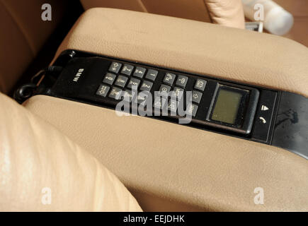 Early car phone in an 80s executive car Stock Photo