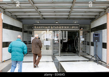 Athens, Greece. 19th January 2015. Two men walk into the main entrance of the Hellenic Statistical Authority. Employees of the Hellenic Statistical Authority staged a 3 hour long strike. They protested against the perceived authoritarian rule of the Authorities president Andreas Georgiou and the penalisation of workers and the disregard of labour laws. Credit:  Michael Debets/Alamy Live News Stock Photo