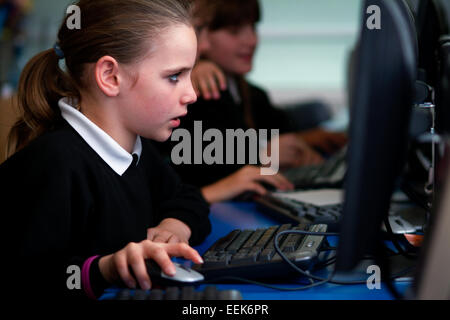 Girl in UK secondary school learning coding on computer Stock Photo