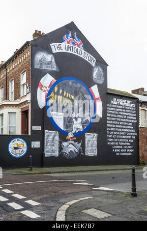 Ulster loyalist wall mural on corner of Canada St Belfast depicting loyalist fleeing to Liverpool. Stock Photo