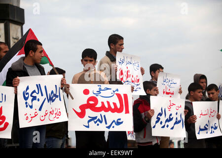 Jan. 19, 2015 - Gaza City, Gaza Strip, Palestinian Territory - Palestinian youth hold placards during a protest demanding for open a waterway between the besieged Gaza Strip and the world, at the Gaza's seaport, January 19, 2015. The governmental Committee to Break the Siege on Gaza declared Monday the beginning of  the rehabilitation of a waterway that would link the Strip with the outside world as a prelude for  the establishment of an international port  (Credit Image: © Ashraf Amra/APA Images/ZUMA Wire) Stock Photo